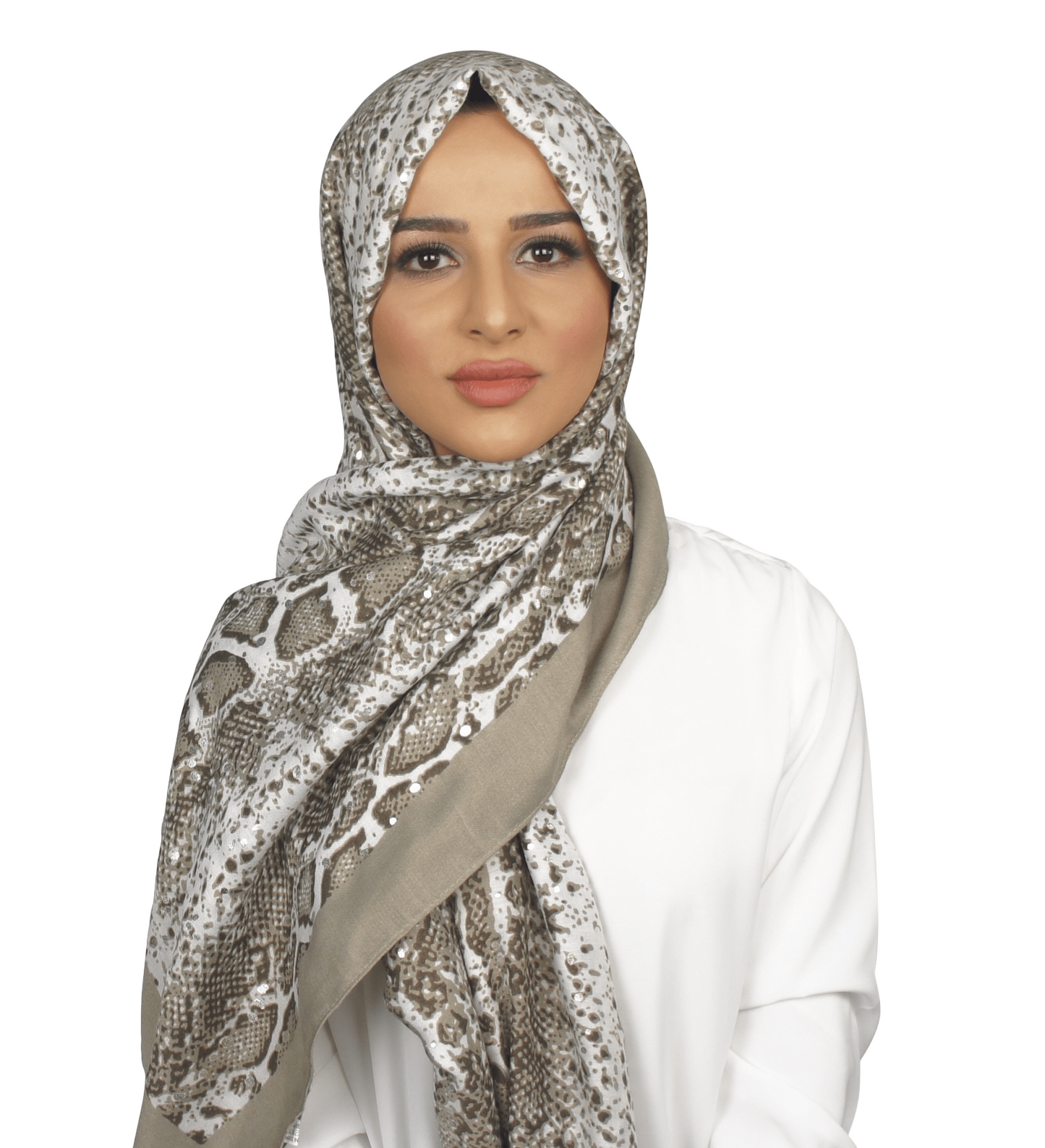 Woman wearing a patterned hijab on a white background